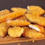 Breaded cornflakes chicken inner fillet (whole muscle) - Délices & Snacks